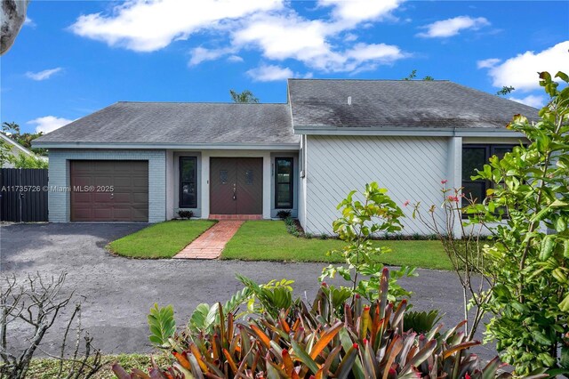 single story home with a garage