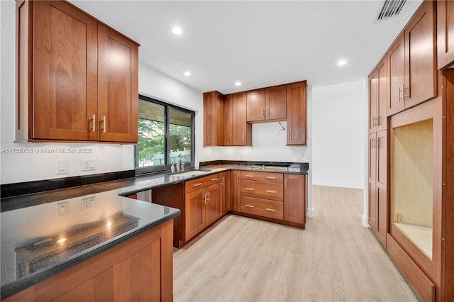 kitchen featuring visible vents and brown cabinets