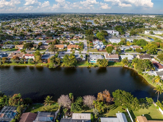 bird's eye view featuring a water view and a residential view