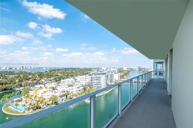 balcony featuring a water view