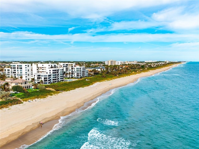 bird's eye view featuring a beach view and a water view