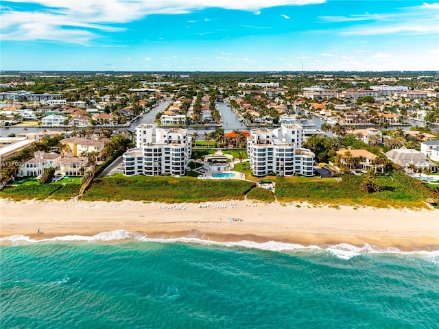 bird's eye view featuring a water view and a view of the beach