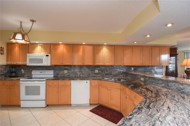 kitchen featuring sink, tasteful backsplash, light tile patterned floors, pendant lighting, and white appliances