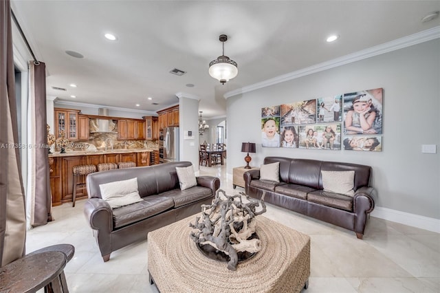 living room with crown molding and an inviting chandelier