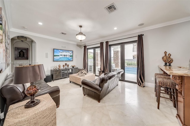 living room with ornamental molding and french doors