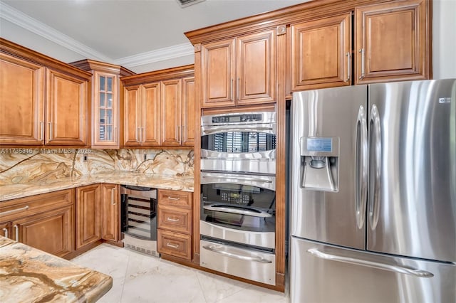 kitchen featuring backsplash, beverage cooler, light stone counters, stainless steel appliances, and crown molding