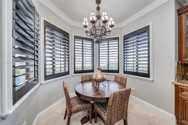 dining space with ornamental molding and a chandelier