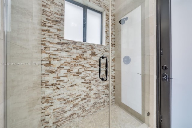 bathroom with a shower with shower door