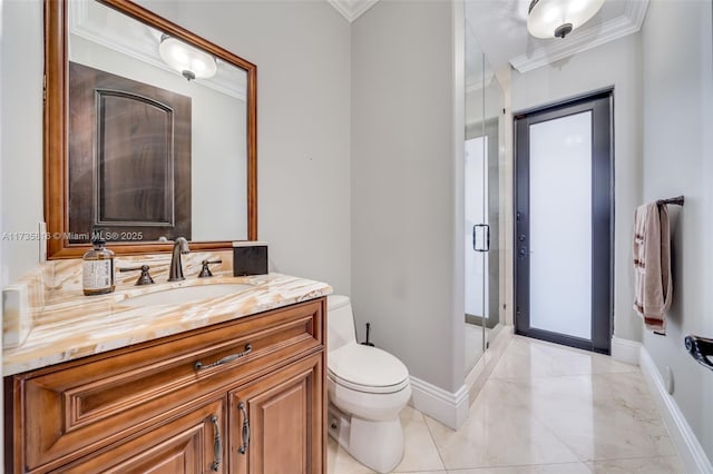 bathroom featuring ornamental molding, vanity, and toilet