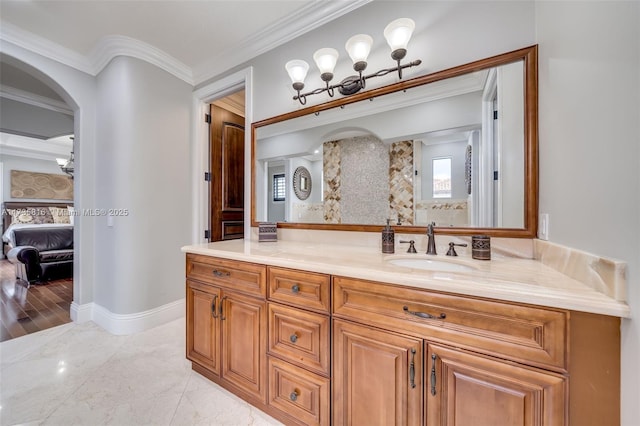 bathroom featuring ornamental molding and vanity