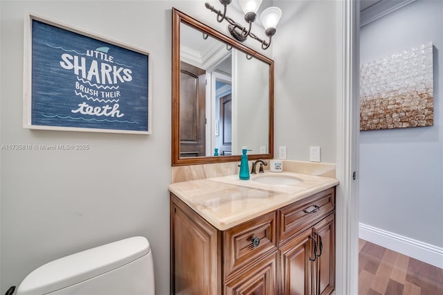 bathroom with vanity, hardwood / wood-style floors, and toilet