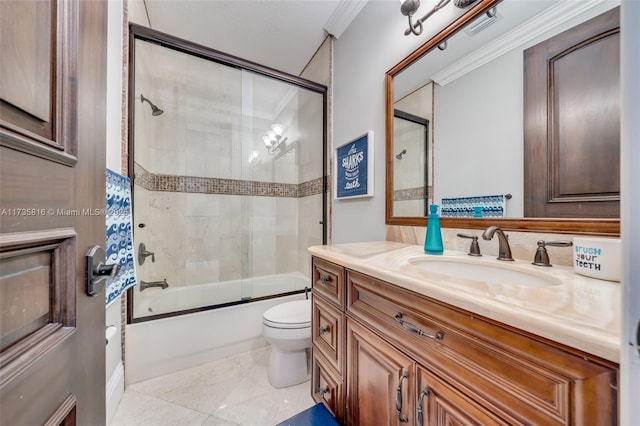 full bathroom featuring vanity, ornamental molding, shower / bath combination with glass door, and toilet