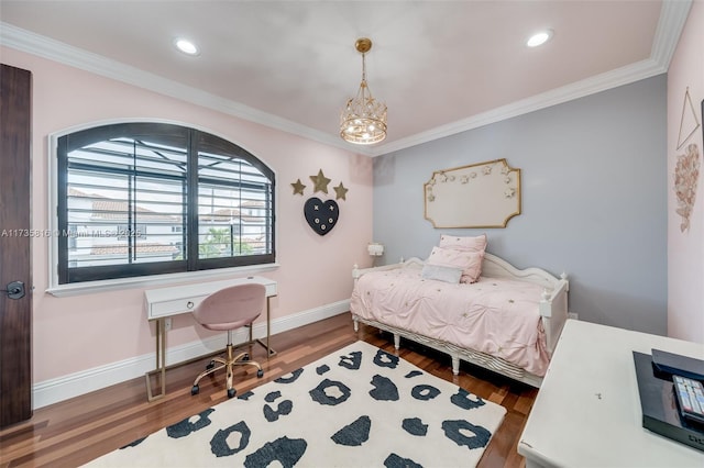 bedroom with crown molding, wood-type flooring, and an inviting chandelier