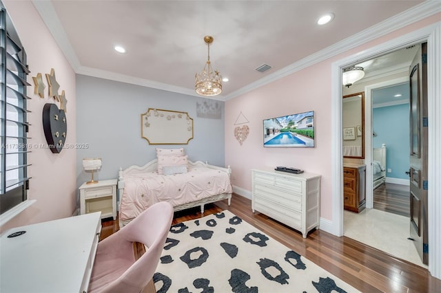 bedroom featuring connected bathroom, crown molding, dark hardwood / wood-style floors, and a chandelier