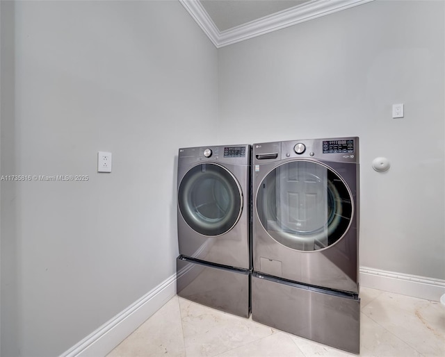 clothes washing area featuring crown molding and independent washer and dryer