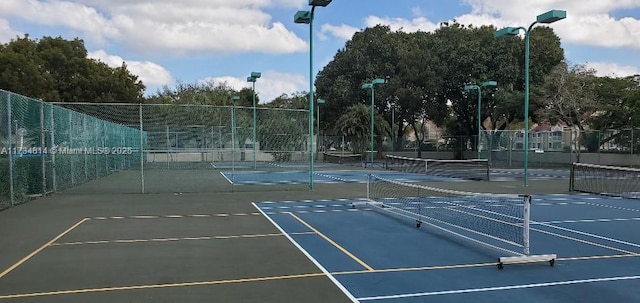 view of sport court with fence