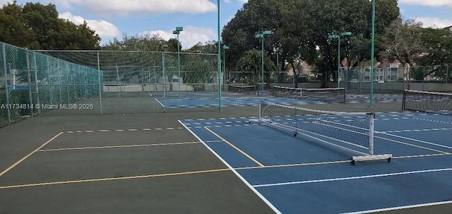 view of sport court with fence