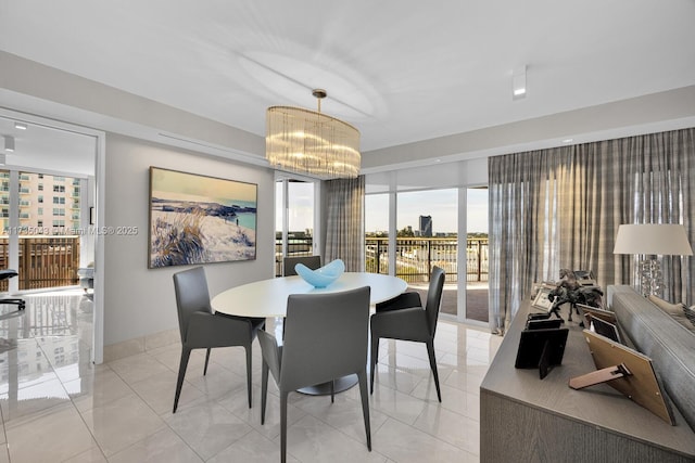 tiled dining area featuring a notable chandelier