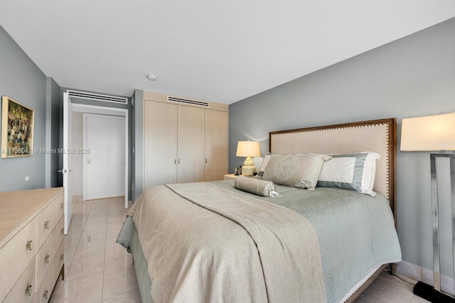 tiled bedroom with two closets