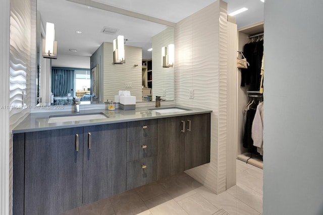 bathroom with tile patterned flooring and vanity