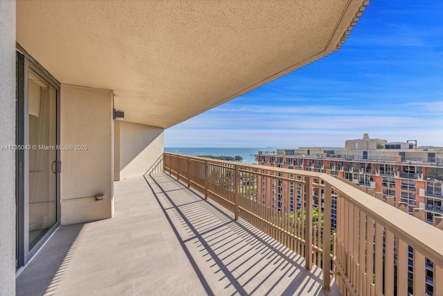 balcony featuring a water view