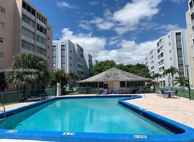 view of swimming pool with a patio area