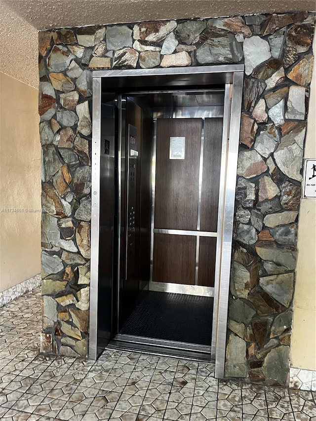 doorway to property with elevator