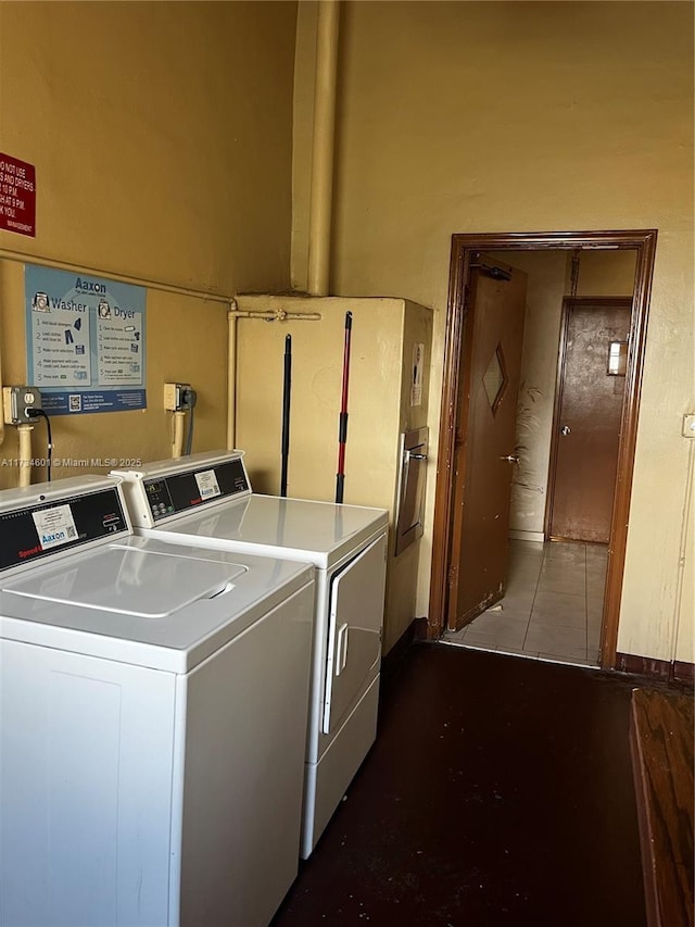 washroom with tile patterned flooring and independent washer and dryer