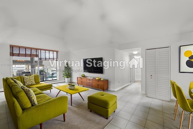 1666 W Ave Unit 207, Miami Beach, FL 33139 - living room featuring high vaulted ceiling and light tile patterned floors