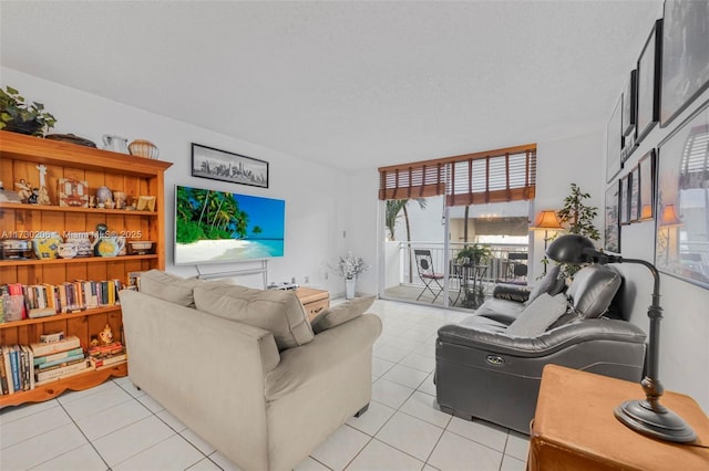 1666 W Ave Unit 207, Miami Beach, FL 33139 - living room with light tile patterned floors, expansive windows, and a textured ceiling