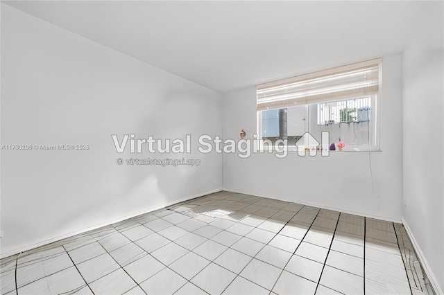 1666 W Ave Unit 207, Miami Beach, FL 33139 - tiled spare room with baseboards