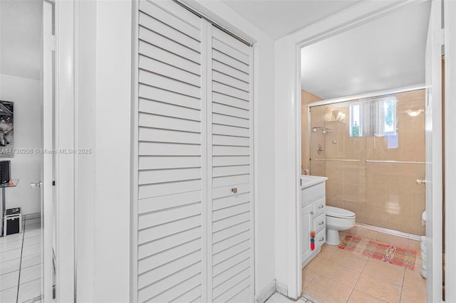 1666 W Ave Unit 207, Miami Beach, FL 33139 - full bathroom featuring a shower stall, tile patterned floors, vanity, and a closet