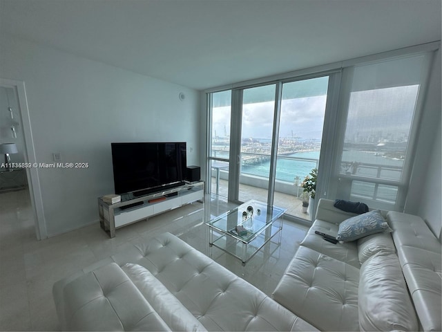 living room featuring floor to ceiling windows