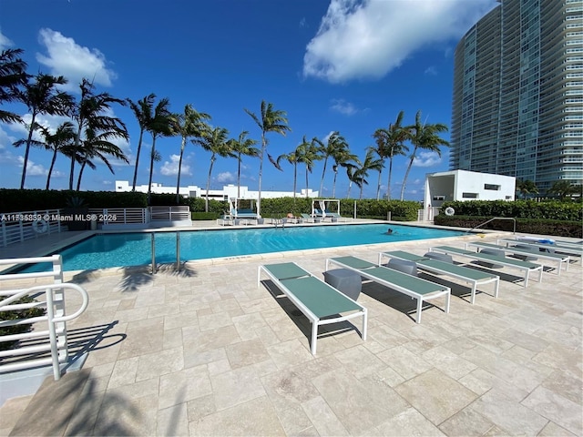 view of swimming pool featuring a patio area