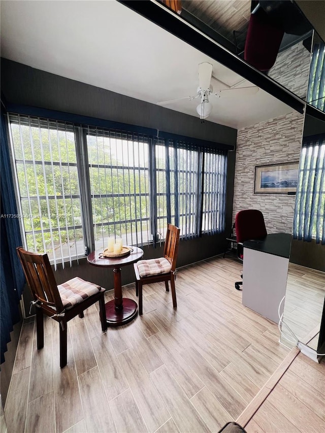 sunroom / solarium with ceiling fan and plenty of natural light