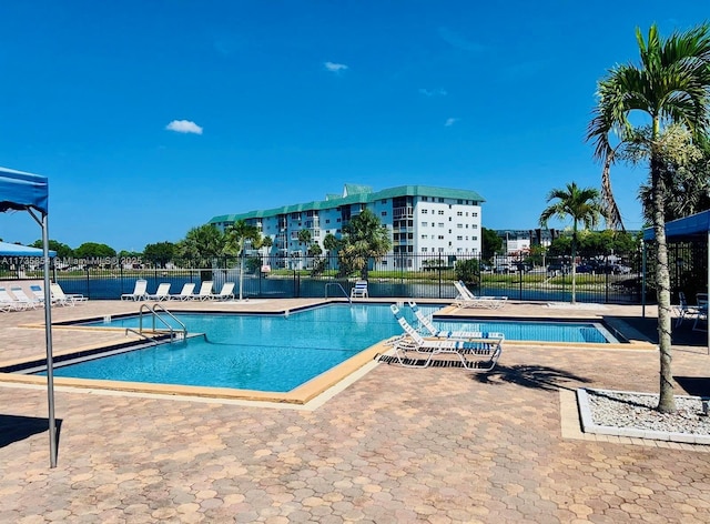 view of swimming pool featuring a patio