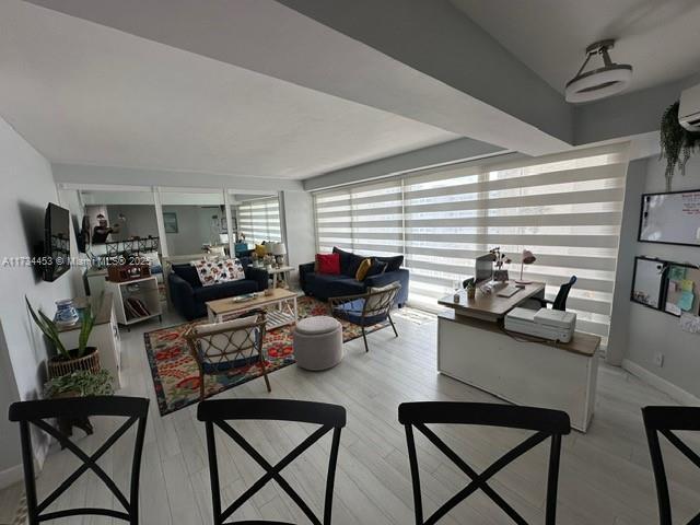 living room with light hardwood / wood-style floors