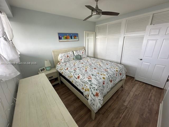 bedroom with ceiling fan and dark hardwood / wood-style flooring