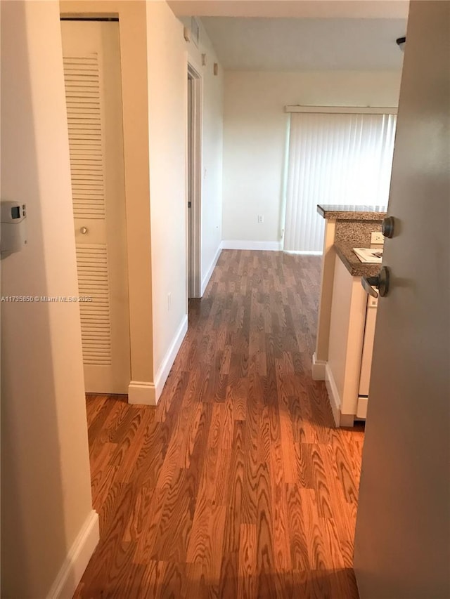 corridor featuring hardwood / wood-style floors