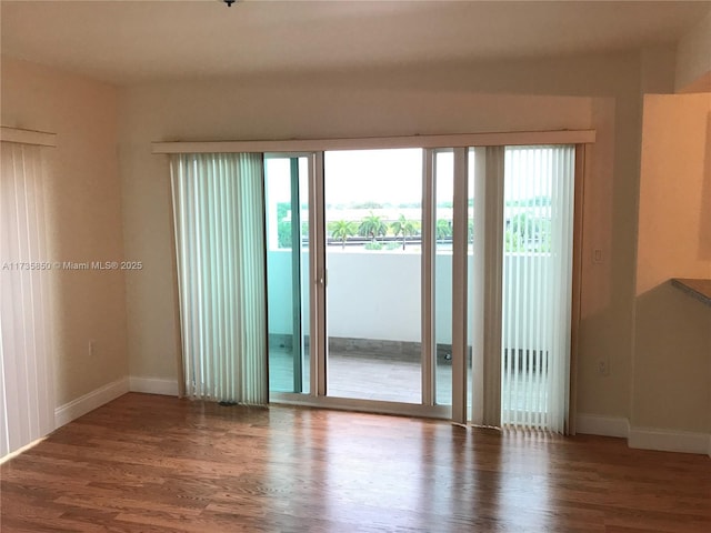 unfurnished room featuring dark hardwood / wood-style floors