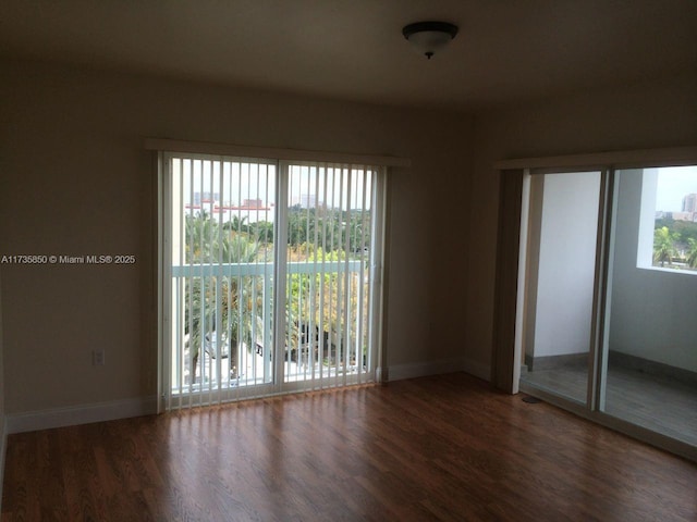 empty room featuring dark hardwood / wood-style flooring