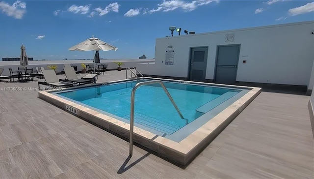 view of swimming pool featuring a patio