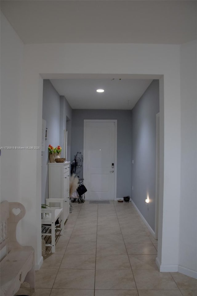 hallway featuring light tile patterned floors