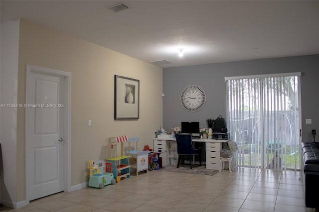 home office featuring light tile patterned floors