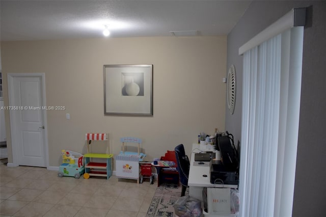 recreation room featuring light tile patterned flooring