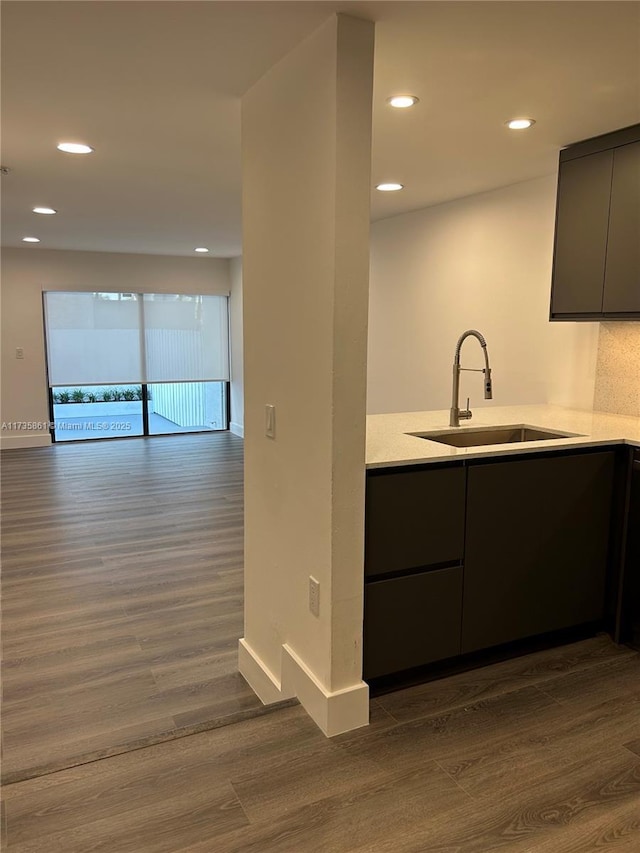 kitchen featuring sink, gray cabinets, and dark hardwood / wood-style floors