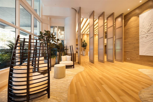 interior space with wood-type flooring and wood walls