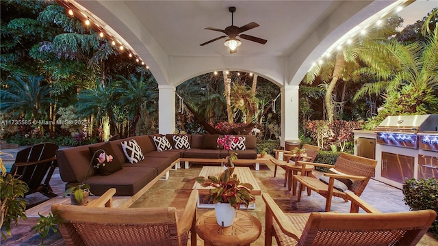 view of patio with an outdoor living space, an outdoor kitchen, a grill, and ceiling fan