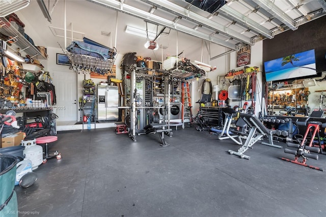 exercise room with a towering ceiling and a workshop area