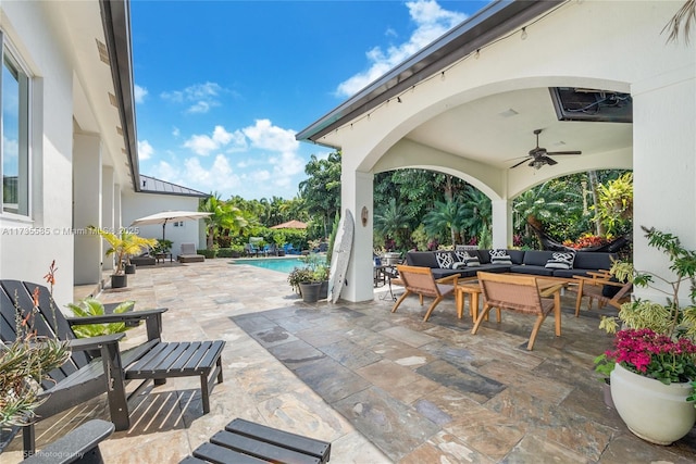 view of patio / terrace with ceiling fan and an outdoor living space